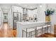 Stylish kitchen with stainless steel appliances, white cabinets, and a breakfast bar at 57 Moury Se Ave, Atlanta, GA 30315