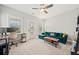 Comfortable living room area with modern furnishings, a ceiling fan, and an adjacent desk at 57 Moury Se Ave, Atlanta, GA 30315