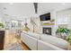 Cozy living room with fireplace, hardwood floors, and seamless flow to the kitchen at 57 Moury Se Ave, Atlanta, GA 30315