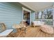 Charming porch with wood floors, lounge area, and adjacent access to interior bedroom at 57 Moury Se Ave, Atlanta, GA 30315