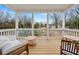 Cozy porch featuring wood floors and an outdoor living area with seating and views at 57 Moury Se Ave, Atlanta, GA 30315