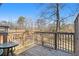 Wooden back deck with railings provides a serene outdoor space overlooking the lawn at 346 Mays Rd, Stockbridge, GA 30281