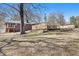 Expansive backyard featuring a large wooden deck, perfect for outdoor entertaining and relaxation at 346 Mays Rd, Stockbridge, GA 30281