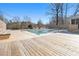 Pool with wooden deck offers space for entertaining and leisure in the backyard at 346 Mays Rd, Stockbridge, GA 30281