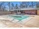 Pool with a wood deck and fence offers a private backyard retreat in the backyard at 346 Mays Rd, Stockbridge, GA 30281