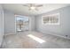 Bedroom with sliding glass door to balcony and lots of natural light at 346 Mays Rd, Stockbridge, GA 30281