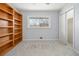 Bedroom featuring built in bookshelves, soft carpet and large closet at 346 Mays Rd, Stockbridge, GA 30281