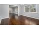 Dining room boasts hardwood floors, neutral paint, and large window with natural light at 346 Mays Rd, Stockbridge, GA 30281