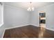 Formal dining room with hardwood floors and a stylish chandelier at 346 Mays Rd, Stockbridge, GA 30281