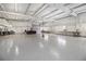 Large commercial garage featuring smooth concrete floors, overhead lighting, and multiple workspaces at 346 Mays Rd, Stockbridge, GA 30281