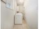 A laundry room area shows a white washer and dryer, and a window allowing natural light at 346 Mays Rd, Stockbridge, GA 30281