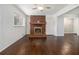 Living room featuring a brick fireplace, ceiling fan, and hardwood floors at 346 Mays Rd, Stockbridge, GA 30281