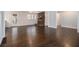 Spacious living room with dark wood floors and brick fireplace at 346 Mays Rd, Stockbridge, GA 30281