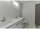 Bathroom with dual sinks and a tiled shower with a glass door at 4348 Hamilton Mill Rd, Buford, GA 30518