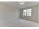 Comfortable bedroom filled with natural light through a large window at 4348 Hamilton Mill Rd, Buford, GA 30518