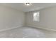 Unfurnished bedroom features neutral paint, trim, and a window at 4348 Hamilton Mill Rd, Buford, GA 30518