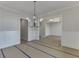 Dining room with wainscoting, modern chandelier, and open layout for easy entertaining at 4348 Hamilton Mill Rd, Buford, GA 30518