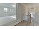 Hallway with view to bonus room with lots of natural light at 4348 Hamilton Mill Rd, Buford, GA 30518