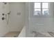 Tiled shower and large window with a view at 4348 Hamilton Mill Rd, Buford, GA 30518