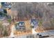 Aerial view of two houses in a wooded neighborhood, showcasing their driveways and landscaping at 4356 Hamilton Mill Rd, Buford, GA 30518