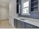 Stylish bar area features shaker cabinets, countertop and modern backsplash at 4356 Hamilton Mill Rd, Buford, GA 30518