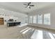 Open concept kitchen features white cabinetry, a dark island, and modern finishes at 4356 Hamilton Mill Rd, Buford, GA 30518