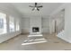 Bright living room with a fireplace, built-ins, and large windows at 4356 Hamilton Mill Rd, Buford, GA 30518