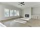 Spacious living room featuring a fireplace, built-in cabinets, and large windows at 4356 Hamilton Mill Rd, Buford, GA 30518