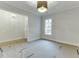 Bright and airy room with a large window and modern lighting at 4356 Hamilton Mill Rd, Buford, GA 30518