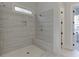 Modern tiled shower with dual showerheads and a built-in bench at 4356 Hamilton Mill Rd, Buford, GA 30518