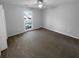 Bedroom featuring neutral walls, carpet, and a ceiling fan at 1720 Winners Cir, Lawrenceville, GA 30043