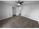 Bright bedroom with large closet, neutral walls, and carpet at 1720 Winners Cir, Lawrenceville, GA 30043