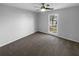 Bright bedroom features neutral walls, a ceiling fan, and a large window at 1720 Winners Cir, Lawrenceville, GA 30043