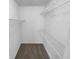 Walk-in closet features shelving and new carpet at 1720 Winners Cir, Lawrenceville, GA 30043