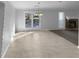 Dining area with a view of the backyard, featuring access to the deck and fireplace at 1720 Winners Cir, Lawrenceville, GA 30043