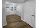 Bright entryway featuring wood-look flooring, white walls, and a door with windows for plenty of natural light at 1720 Winners Cir, Lawrenceville, GA 30043