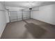 Spacious two-car garage with epoxy flooring, an automatic door opener, and ample room for storage and vehicles at 1720 Winners Cir, Lawrenceville, GA 30043