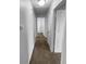 Hallway view with neutral walls and carpet at 1720 Winners Cir, Lawrenceville, GA 30043