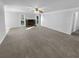 Spacious living room featuring a stone fireplace and neutral walls at 1720 Winners Cir, Lawrenceville, GA 30043