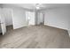 Large bedroom with a ceiling fan, new carpet, and multiple doors at 1720 Winners Cir, Lawrenceville, GA 30043
