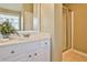 Bathroom featuring a single vanity with white cabinetry and a walk-in shower at 2146 Benchmark Dr, Snellville, GA 30078