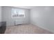 Cozy bedroom with a neutral color palette, plush carpet, and a large window offering city views at 215 Piedmont Ave # Apt 402, Atlanta, GA 30308