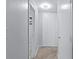 A hallway leading to a bathroom and closet space at 215 Piedmont Ave # Apt 402, Atlanta, GA 30308