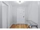 A bright hallway with hardwood floors and a neutral color scheme offers a welcoming entrance at 215 Piedmont Ave # Apt 402, Atlanta, GA 30308
