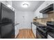 A functional kitchen is equipped with modern appliances, granite counters and ample cabinet space at 215 Piedmont Ave # Apt 402, Atlanta, GA 30308