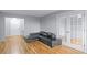 An inviting living room is well-lit and has wood floors and French doors at 215 Piedmont Ave # Apt 402, Atlanta, GA 30308