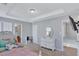 Bedroom with a tray ceiling design, complemented by neutral paint and carpet, creating a serene retreat at 2565 Rocky Ct, South Fulton, GA 30349