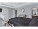 Comfortable bedroom with a chandelier, decorative mirror, closet, and ensuite bathroom access at 2565 Rocky Ct, South Fulton, GA 30349
