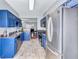 Charming kitchen features stainless steel appliances and blue cabinets, seamlessly blending style with functionality at 2565 Rocky Ct, South Fulton, GA 30349