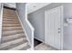 Entryway featuring a carpeted staircase and a white front door at 2565 Rocky Ct, South Fulton, GA 30349